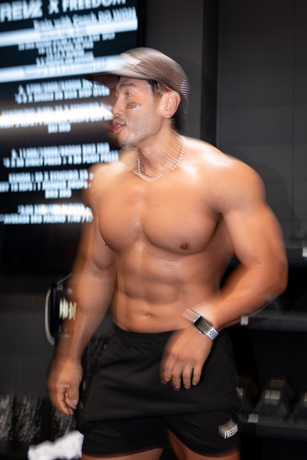 Slow-blur portrait of Coach DB WON leading the REVL x FREEDOM HYROX WOD