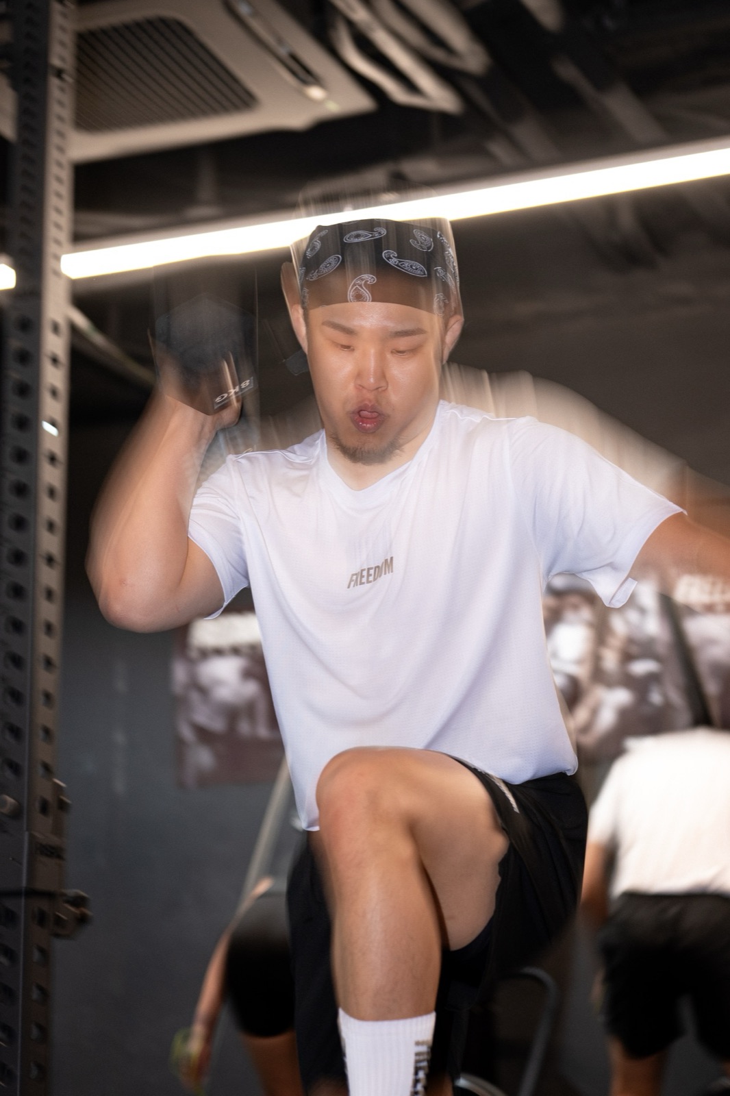 HYROX Korea photo — kettlebell clean at the loaded position, REVL x FREEDOM HYROX class